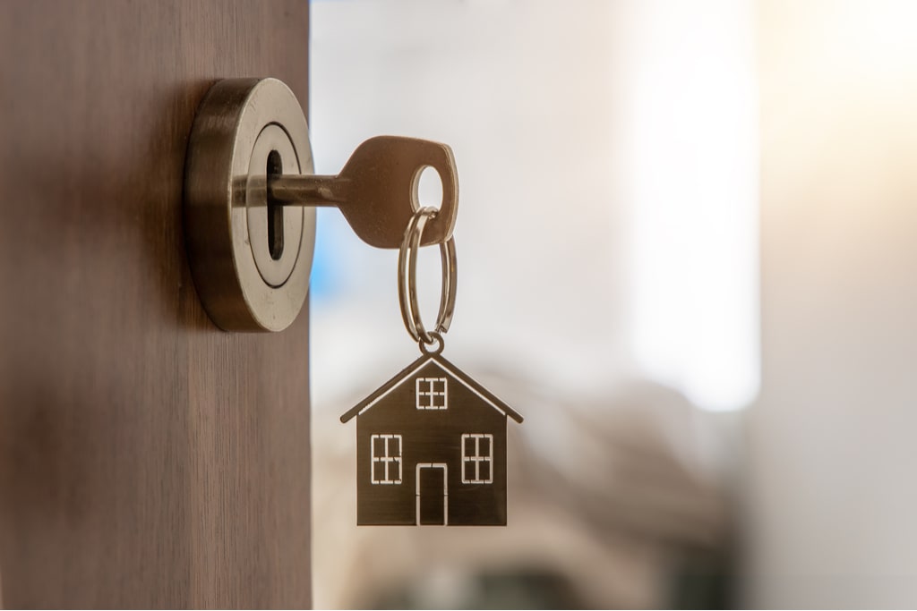 House key hanging from an open door