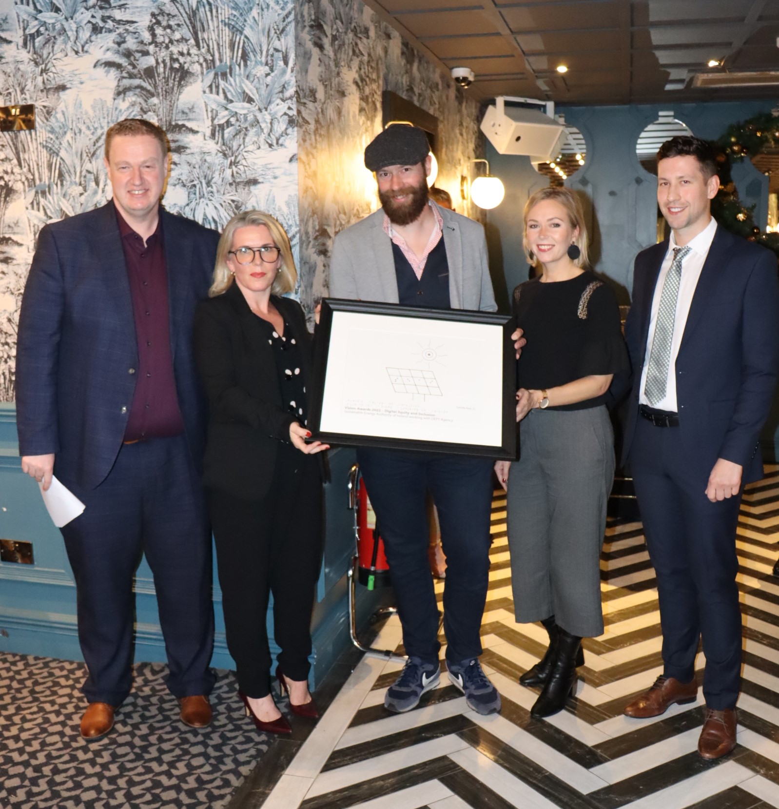 IA Labs Director with representatives from SEAI and Dept Agency, who are holding the Digital Equality and Inclusion Award