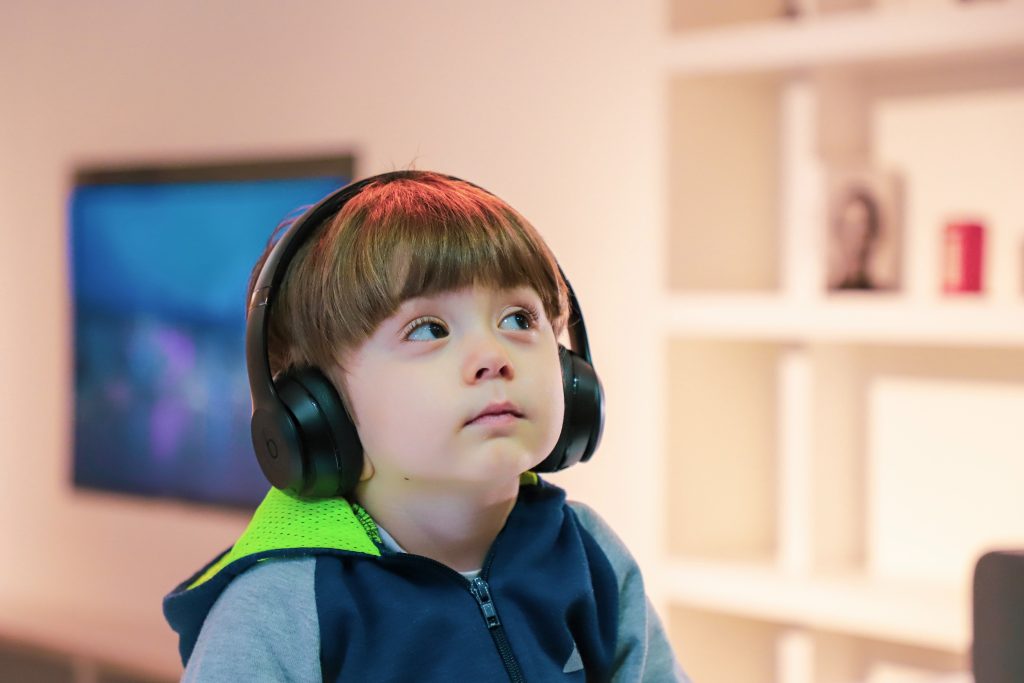 Child on the autism spectrum wearing headphones