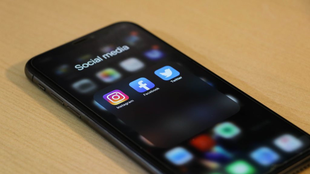 Instagram, Facebook, and Twitter apps on an iPhone